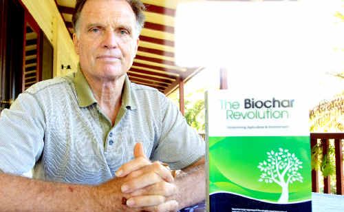 Mt Warning resident and retired astrophysicist Dr Paul Taylor with his book on the benefits of biochar. Mt Warning resident and retired astrophysicist Dr Paul Taylor with his book on the benefits of biochar.